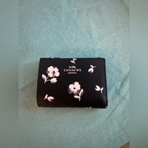 COACH black with white floral wallet